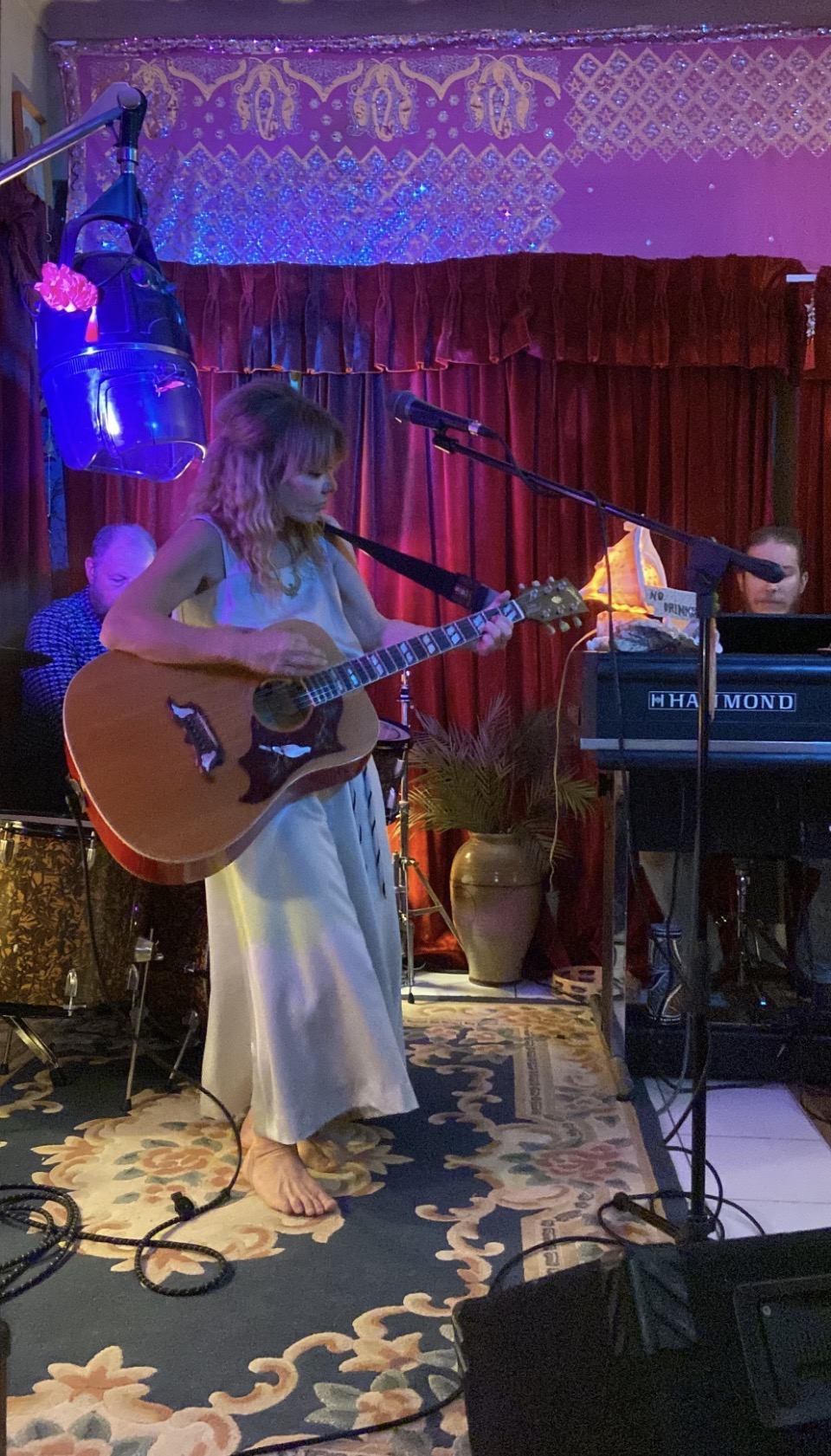Singer in a white dress by the Hammond organ