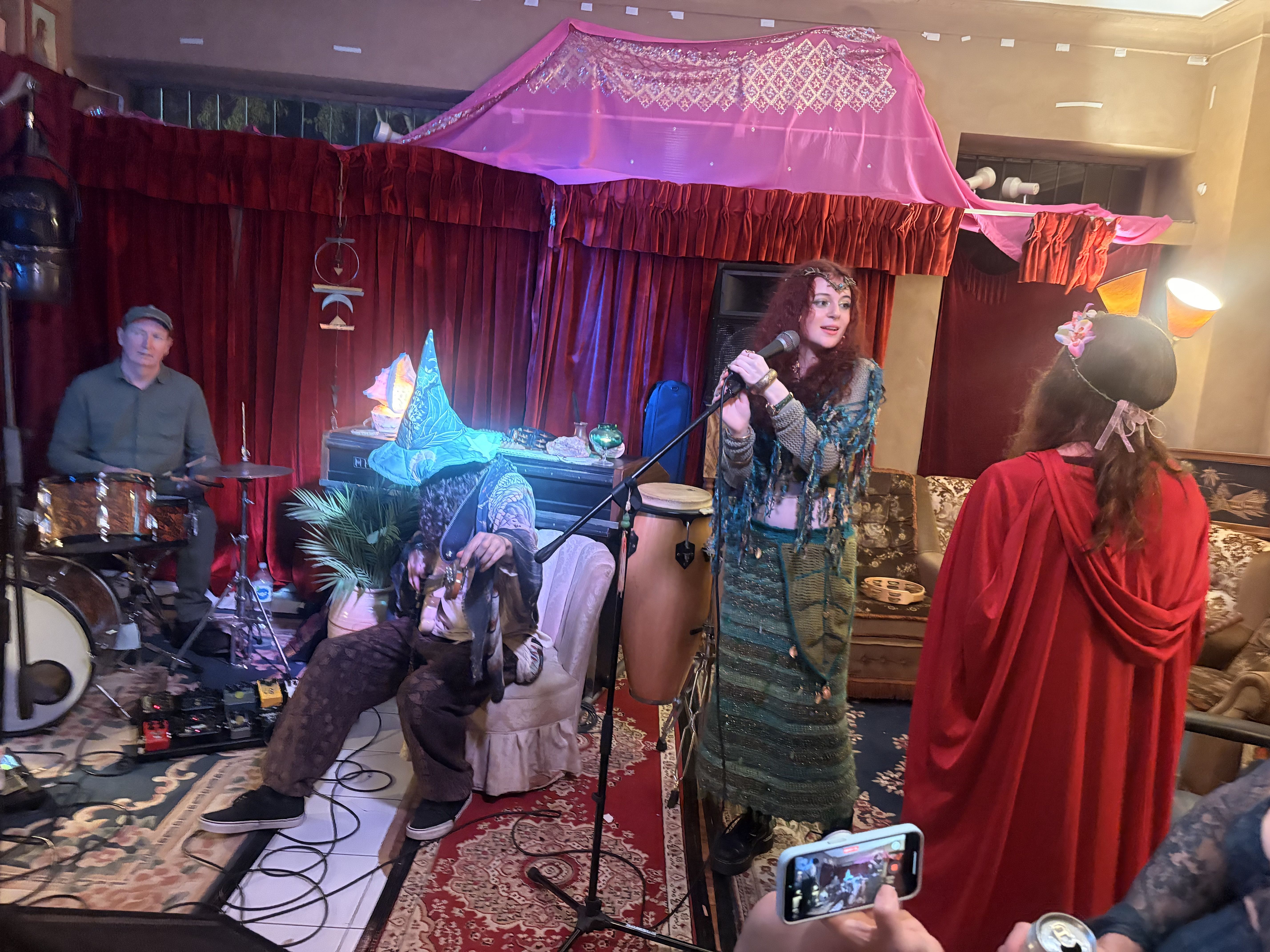 Costumed performance under the pink canopy