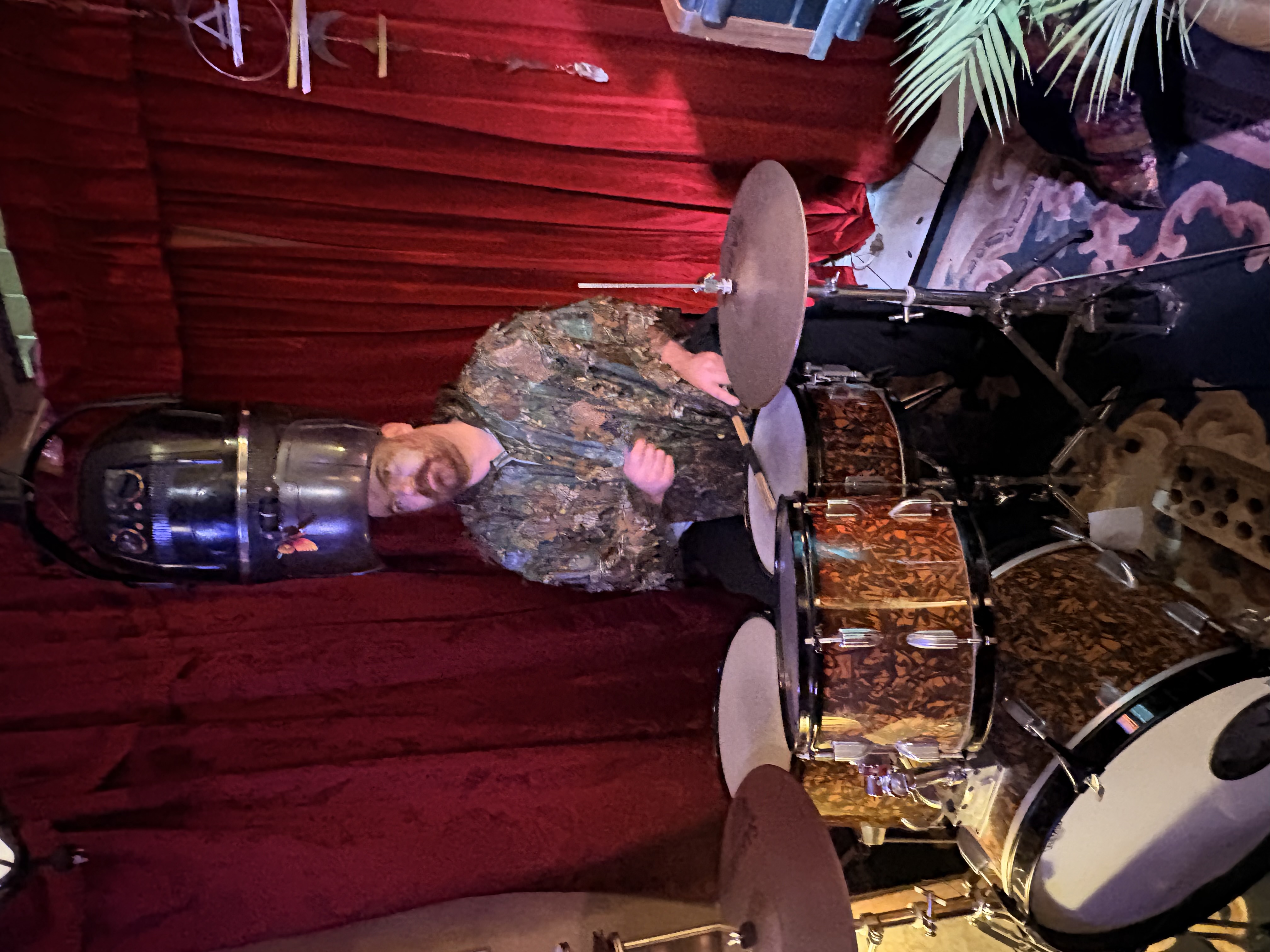 Drummer beneath the vintage hair dryer