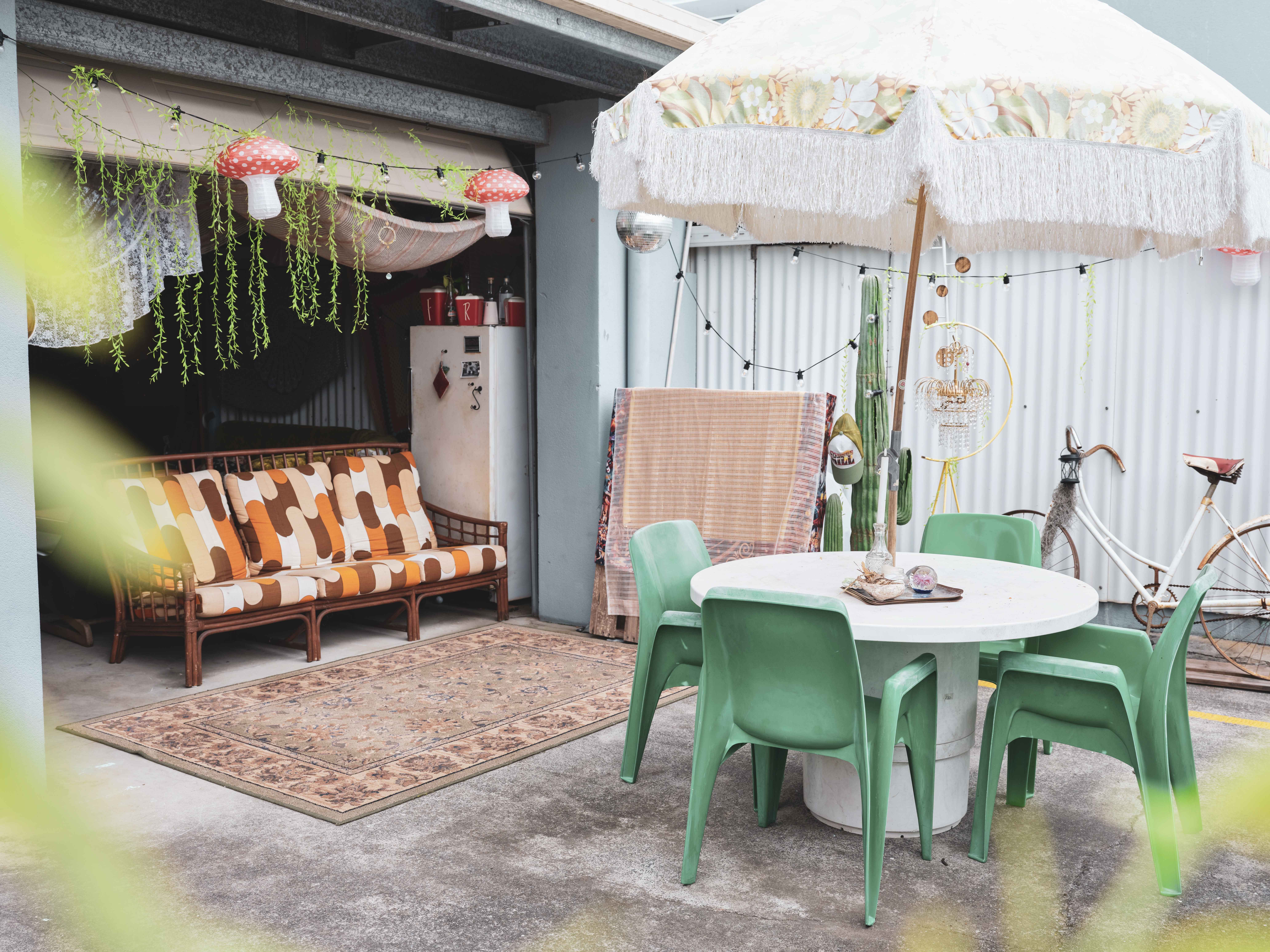 Pink velvet lounge suite under the shuttered window