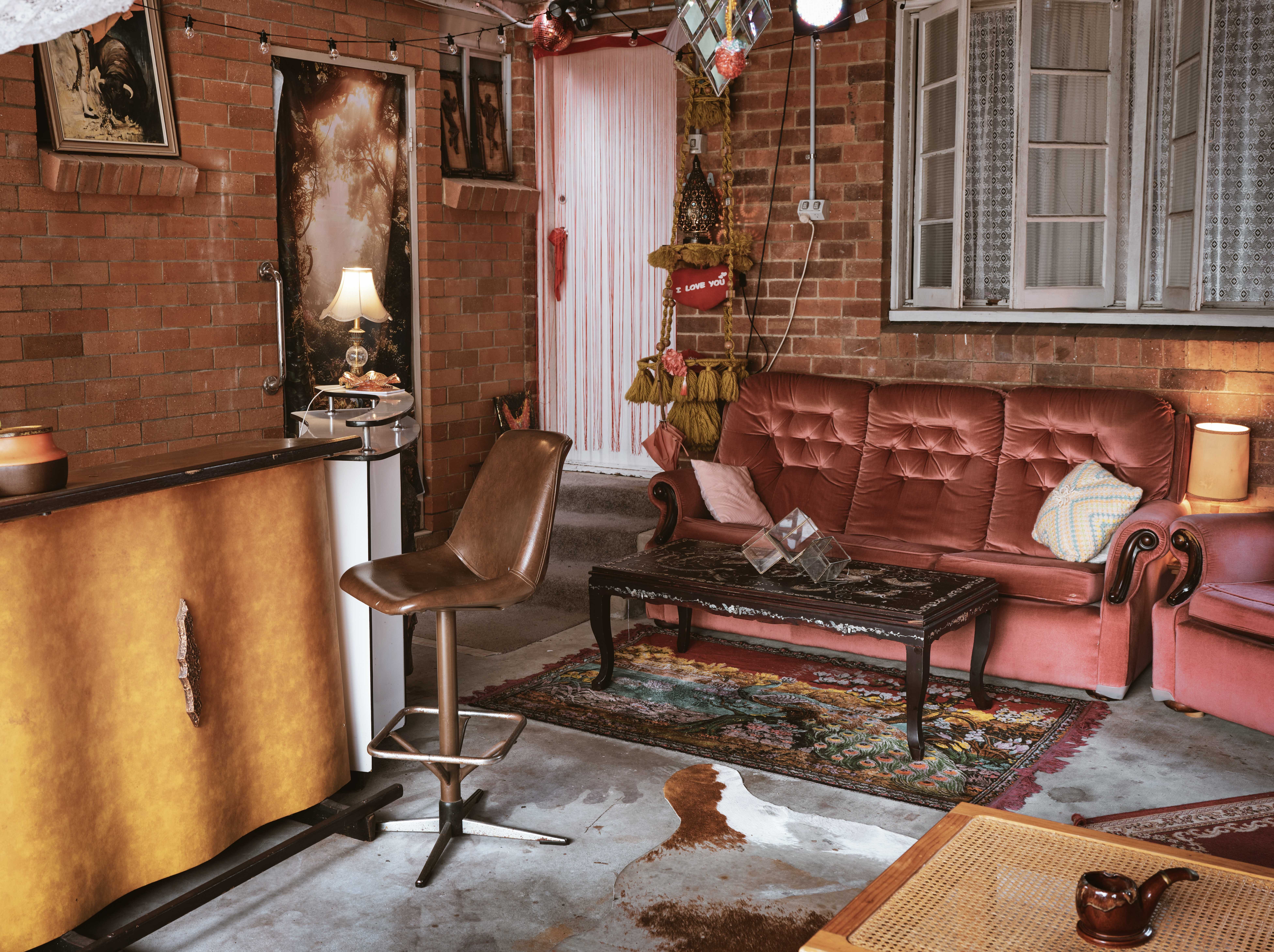 Pink velvet lounge and copper bar in the undercover room