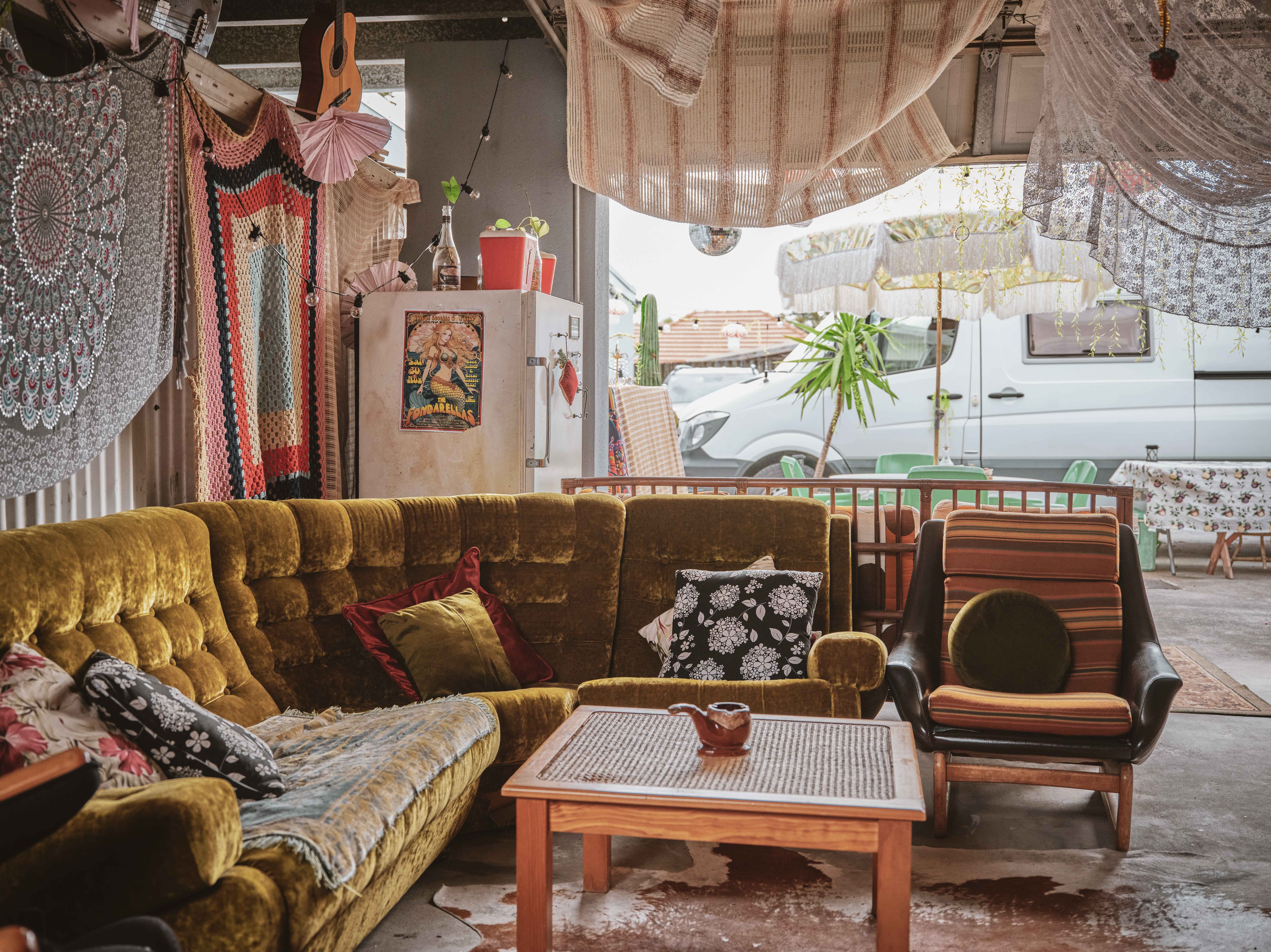 The Snug — deer tapestry, beaded curtain and velvet seating