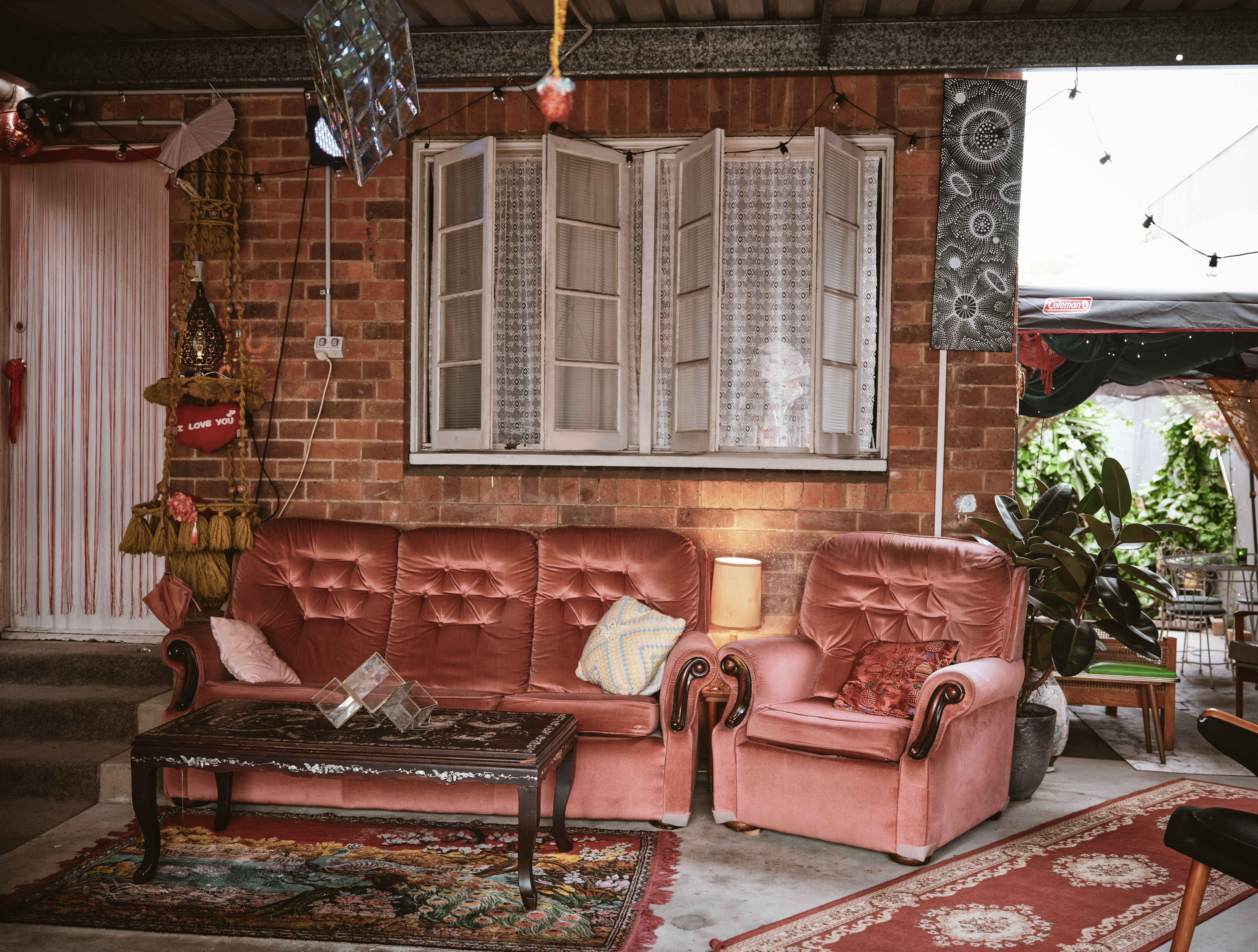 Mustard velvet lounge with gig poster and disco ball