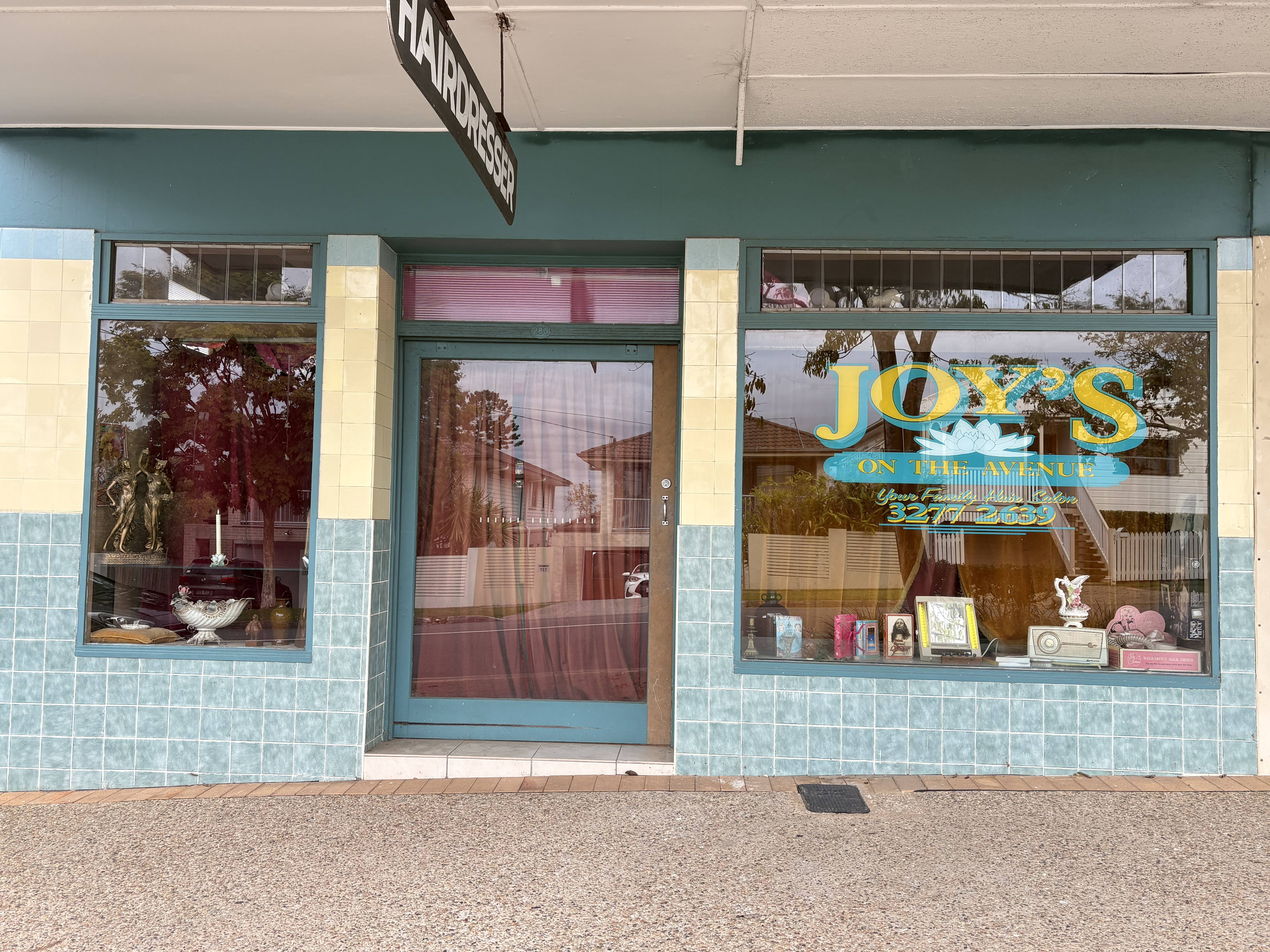 The Joy's on the Avenue shopfront — teal tiles, cream trim and the original painted window sign